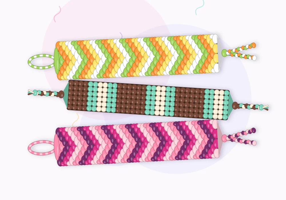Three finished friendship bracelets stacked together: an orange, yellow and lime chevron, a brown and mint striped band, and a plum to blush pink chevron