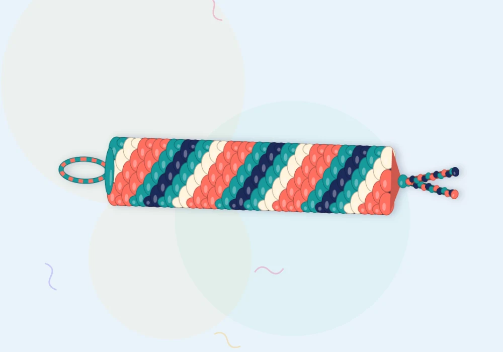 A finished candy stripe bracelet in coral, cream, teal and navy with neatly tied ends