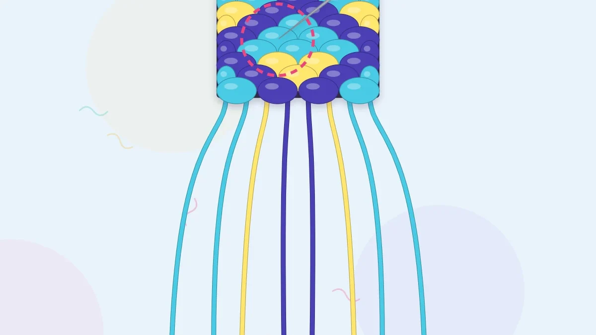 A diamond pattern bracelet in indigo, aqua and lemon with a knot being unpicked using a pin