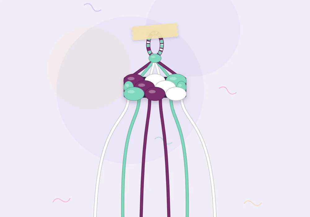 A small braided loop in plum, mint and white at the top of a bracelet with strings hanging below