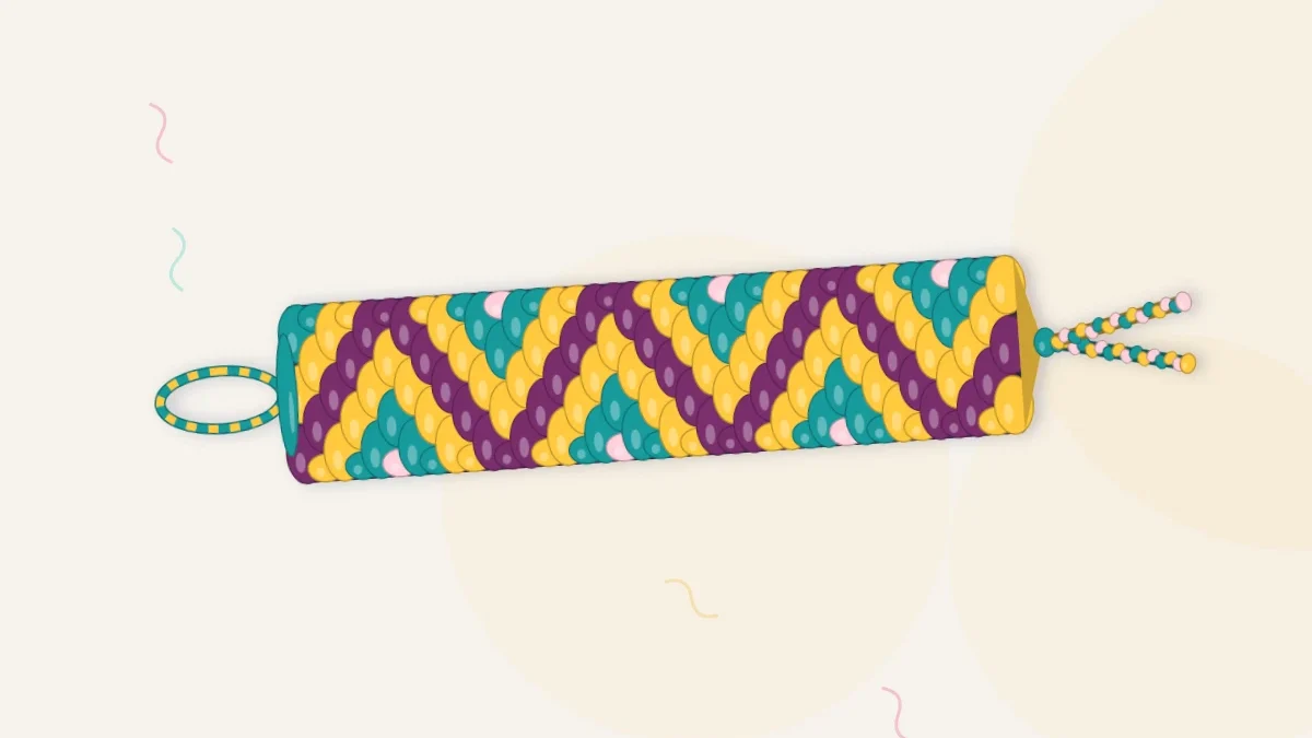 A finished zigzag friendship bracelet with stripes of plum, sun, teal and blush that change direction along its length